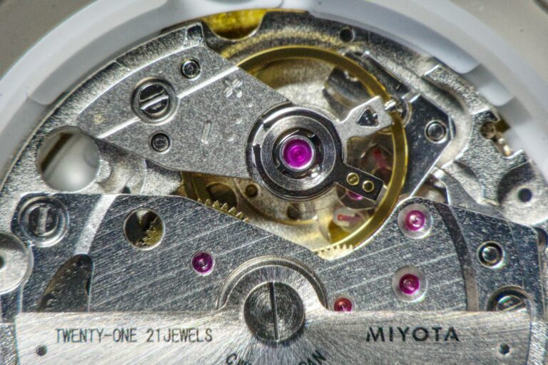 Mechanical Watchmaking Heritage: Escapements, Mainsprings, and the Art of Horological Preservation Intricate mechanical watch movement displaying gears, balance wheel, and jewels