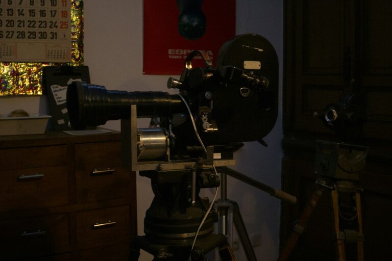 Practical Special Effects and Optical Matte Painting: Mechanical Magic of Pre-CGI Filmmaking Vintage cinema production studio with classic film camera and miniature optical illusion effects