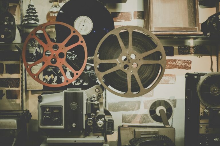 Vintage 35mm cinema film reels and classic movie production camera